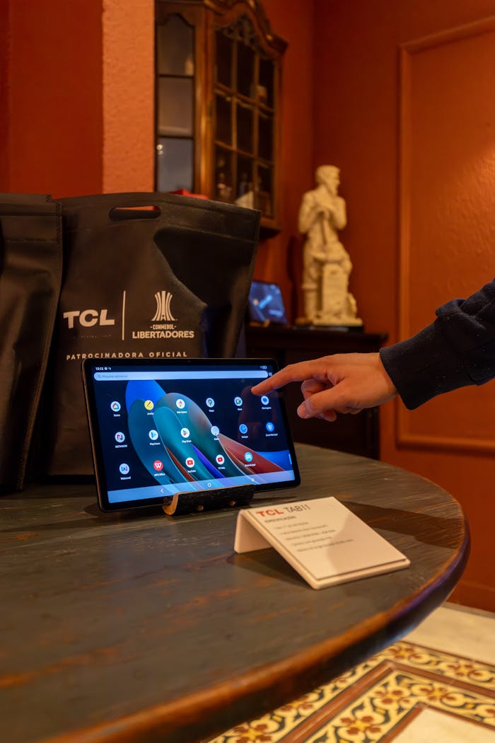 A Person Pointing on a Tablet Touchscreen